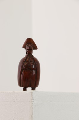 Lot 163 - A coquilla nut figural snuff box