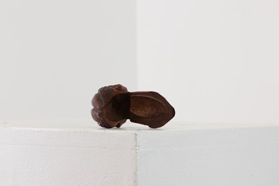 Lot 164 - A coquilla nut figural snuff box