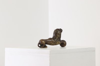 Lot 311 - A Romanesque-style bronze recumbent lion