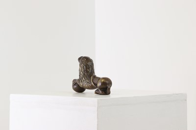 Lot 311 - A Romanesque-style bronze recumbent lion