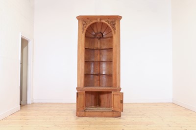 Lot 161 - A George II-style pine standing corner cupboard