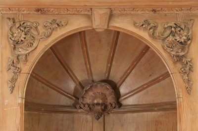 Lot 161 - A George II-style pine standing corner cupboard
