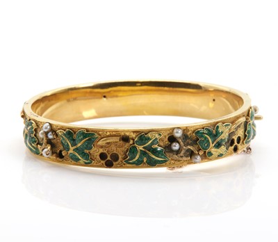 Lot 51 - A Russian enamel and seed pearl gold hinged bangle, c.1848