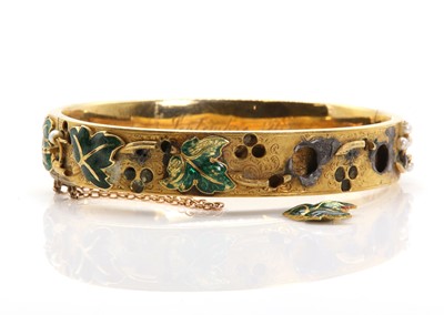 Lot 51 - A Russian enamel and seed pearl gold hinged bangle, c.1848