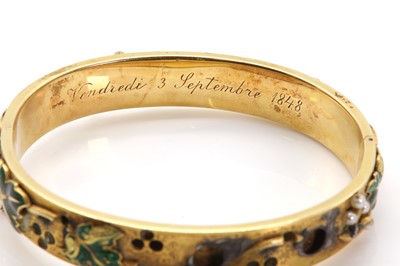 Lot 51 - A Russian enamel and seed pearl gold hinged bangle, c.1848