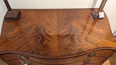 Lot 89 - A George III mahogany serpentine commode