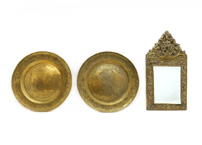 Lot 286 - A brass repousse wall mirror