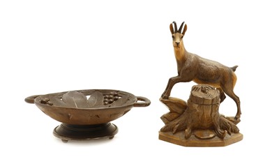 Lot 198 - A Black Forest carved wood musical bowl