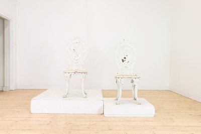 Lot 663 - A pair of Victorian painted cast iron garden chairs