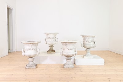 Lot 662 - A set of four Victorian painted cast iron campana urns