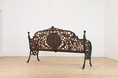 Lot 666 - A large Victorian-style cast iron garden bench