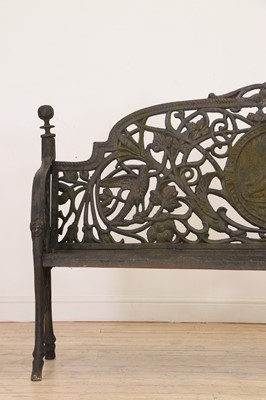Lot 666 - A large Victorian-style cast iron garden bench