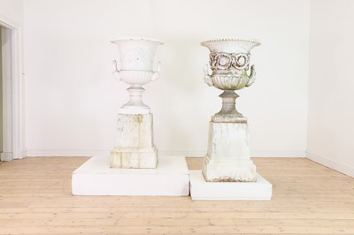 Lot 667 - A near pair of Victorian painted cast iron campana urns