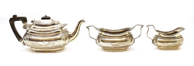 Lot 100 - A silver three piece tea service