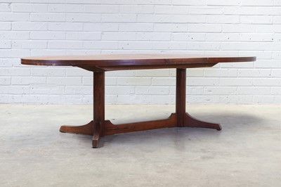 Lot 403 - An extending rosewood dining table