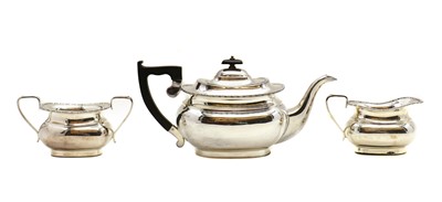 Lot 1 - A silver three piece tea service
