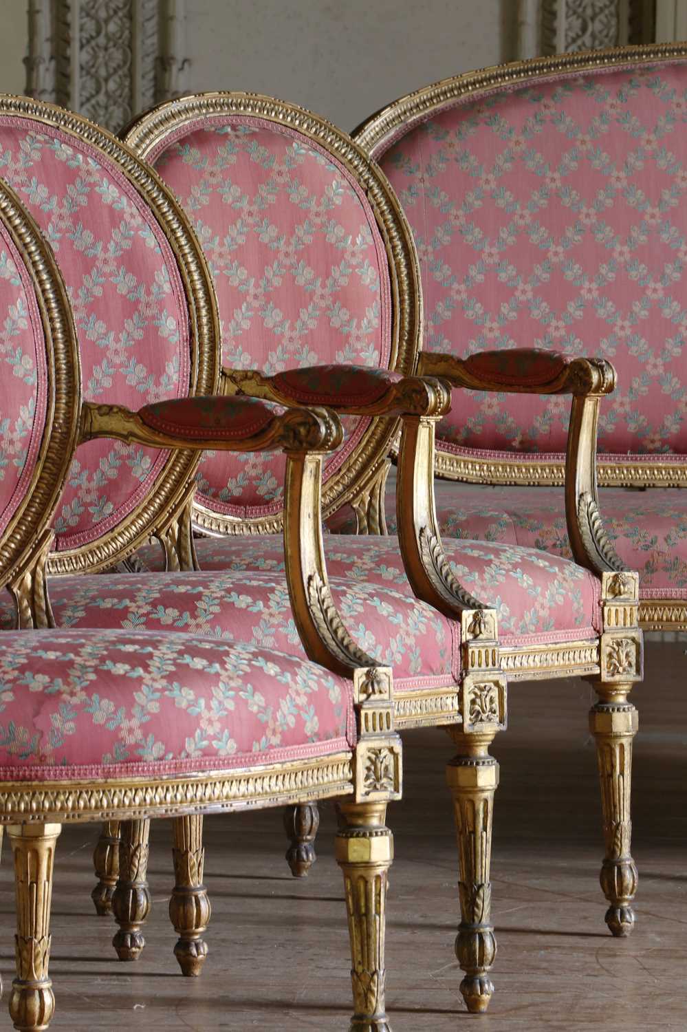Lot 132 - ☘ A set of six giltwood open armchairs of Chippendale design