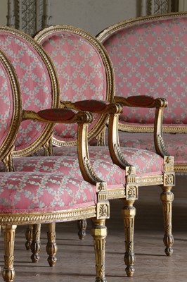 Lot 132 - ☘ A set of six giltwood open armchairs of Chippendale design