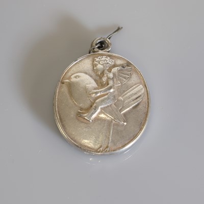 Lot 157 - A white metal locket