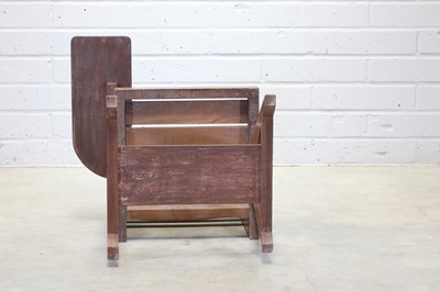 Lot 234 - A teak paddle armchair