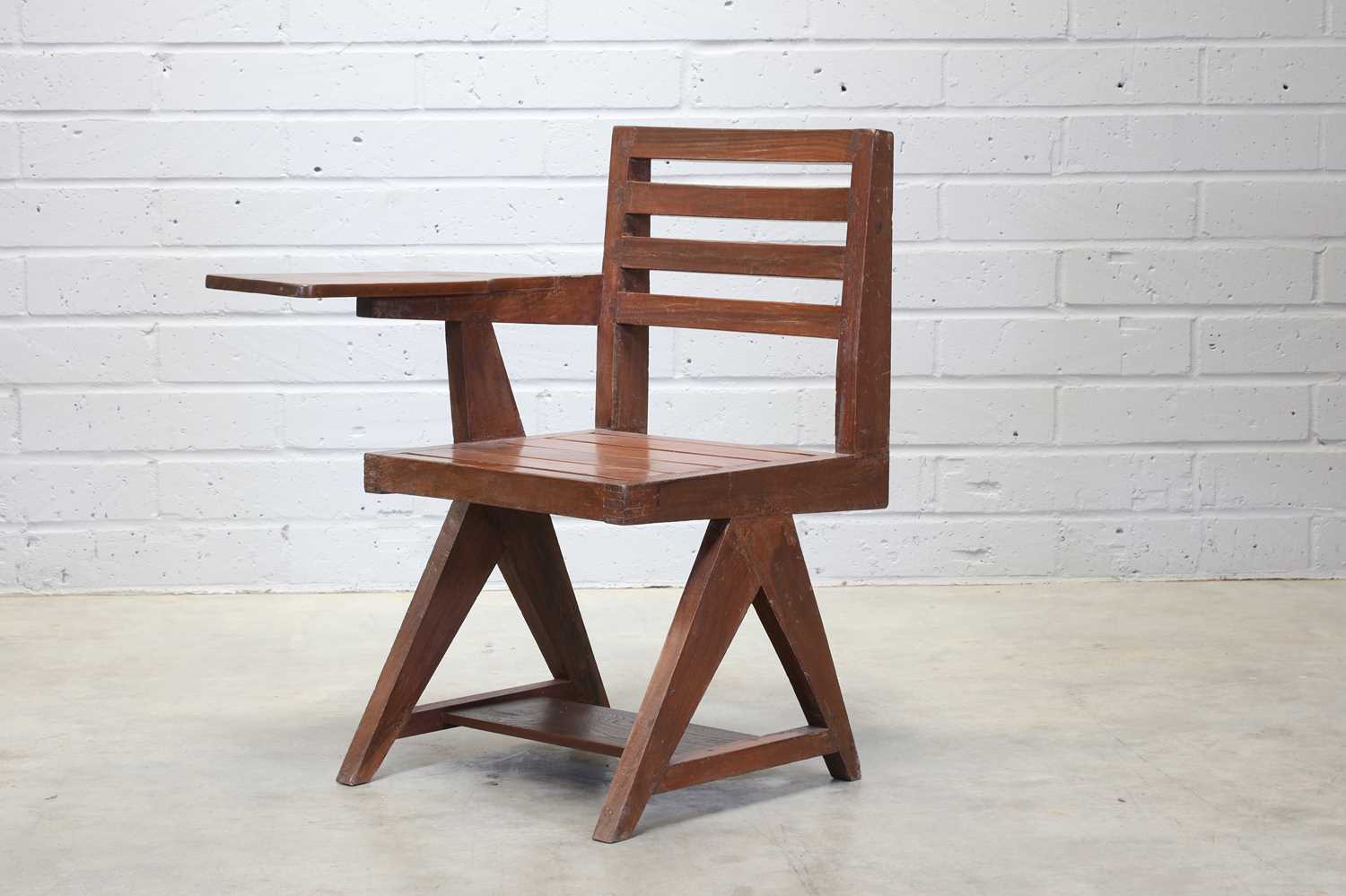 Lot 234 - A teak paddle armchair