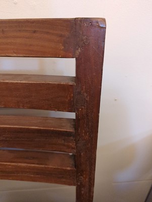 Lot 234 - A teak paddle armchair