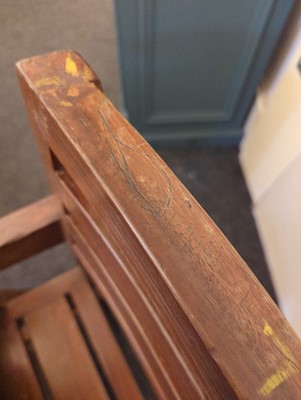 Lot 234 - A teak paddle armchair