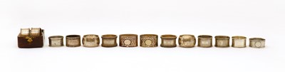 Lot 25 - A collection of fourteen silver napkin rings