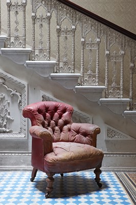 Lot 9 - A red-leather-upholstered tub armchair by Strahan & Co.