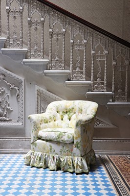 Lot 18 - A button-upholstered tub chair by Howard & Sons
