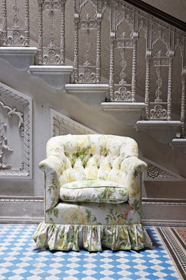 Lot 18 - A button-upholstered tub chair by Howard & Sons