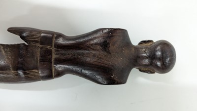 Lot 252 - An ancient Egyptian carved wooden figure in the Middle Kingdom-style