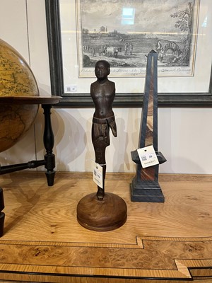 Lot 252 - An ancient Egyptian carved wooden figure in the Middle Kingdom-style
