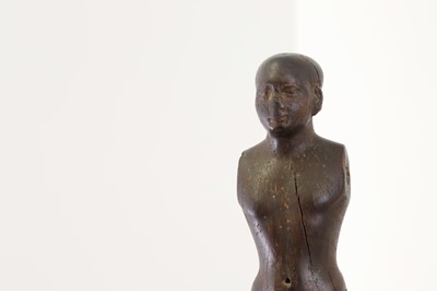 Lot 252 - An ancient Egyptian carved wooden figure in the Middle Kingdom-style