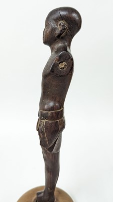 Lot 252 - An ancient Egyptian carved wooden figure in the Middle Kingdom-style