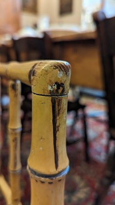 Lot 51 - Two Regency faux bamboo painted open armchairs