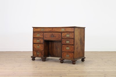 Lot 10 - A camphor wood and brass campaign desk