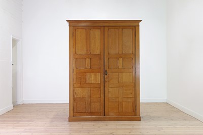 Lot 67 - A blonde oak compactum wardrobe