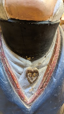 Lot 64 - A carved and painted figurehead