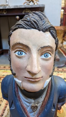 Lot 64 - A carved and painted figurehead
