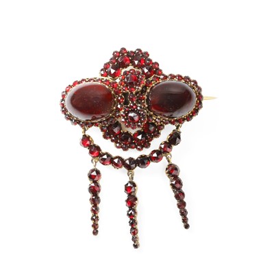 Lot 1022 - An antique gilt metal Bohemian garnet drop brooch