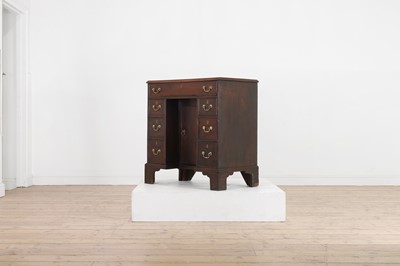 Lot 79 - A George III mahogany kneehole desk