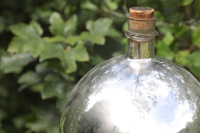 Lot 29 - A mirrored-glass carboy
