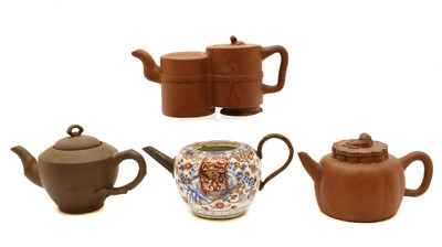 Lot 143 - A Chinese blue and white clobbered teapot