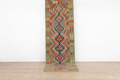 Lot 467 - A kilim wool runner