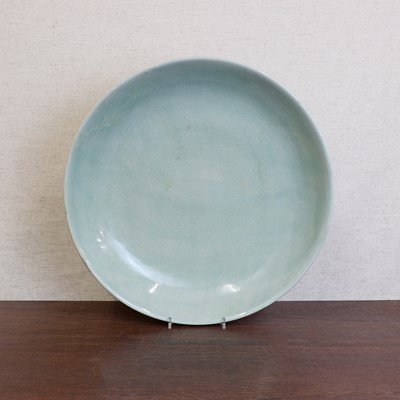 Lot 413 - A Chinese celadon charger