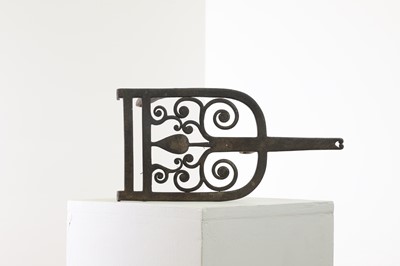 Lot 357 - An Arts and Crafts iron trivet by Edward Spencer