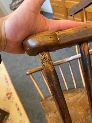 Lot 356 - A large ash and elm comb-back Windsor armchair