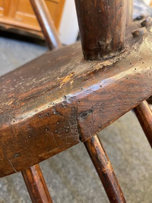 Lot 356 - A large ash and elm comb-back Windsor armchair