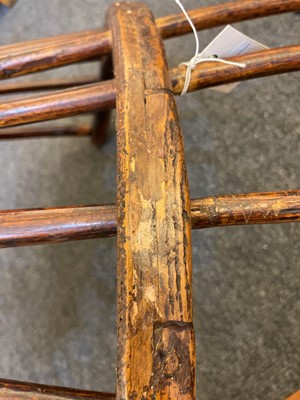 Lot 356 - A large ash and elm comb-back Windsor armchair